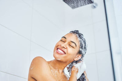 Lady in shower washing hair