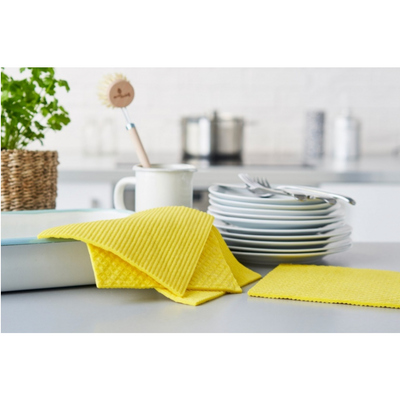 Compostable sponge cloths on dishes